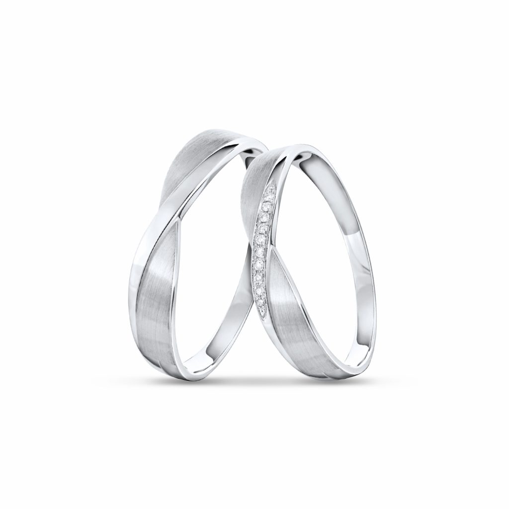 SK couple wedding rings in white gold with diamonds and the bands intertwined into a cross