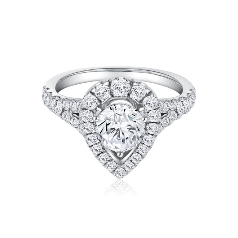 SK teardrop diamond ring with lab grown diamond solitaire in a paved setting in 18k white gold