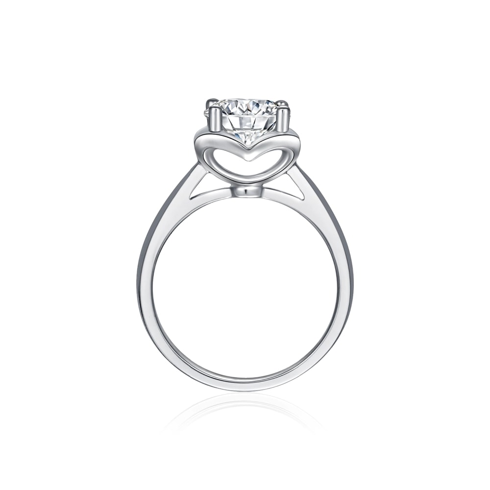 white gold engagement ring with heart shaped cathedral setting