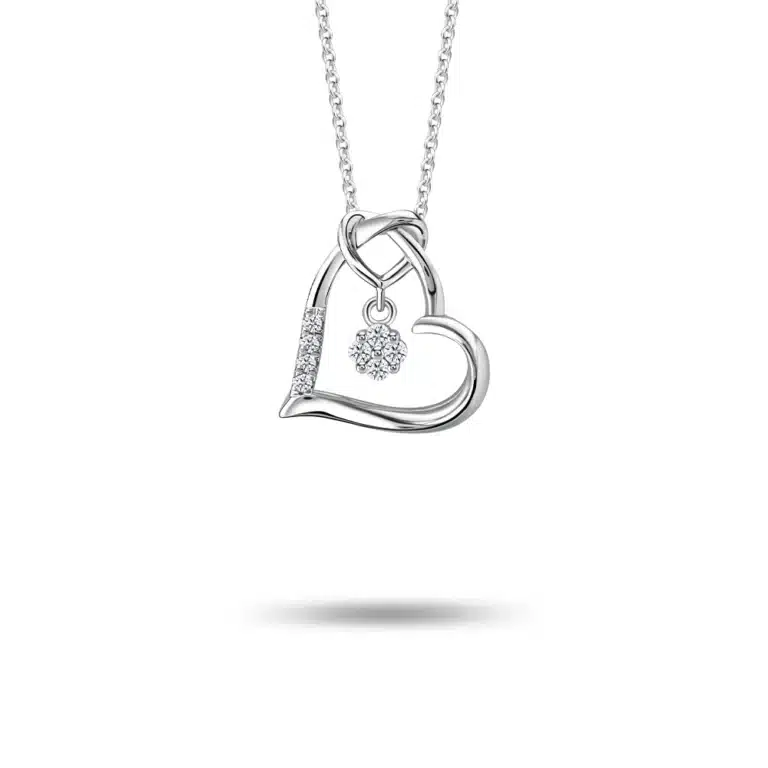 Stellar Heart 10K Diamond Pendant necklace for women, crafted in white gold with a sleek heart-shaped design, featuring a sparkling diamond outline and a suspended diamond centerpiece. Adorned with eight lab-grown diamonds (0.06ct). Includes a detachable 10K white gold chain.