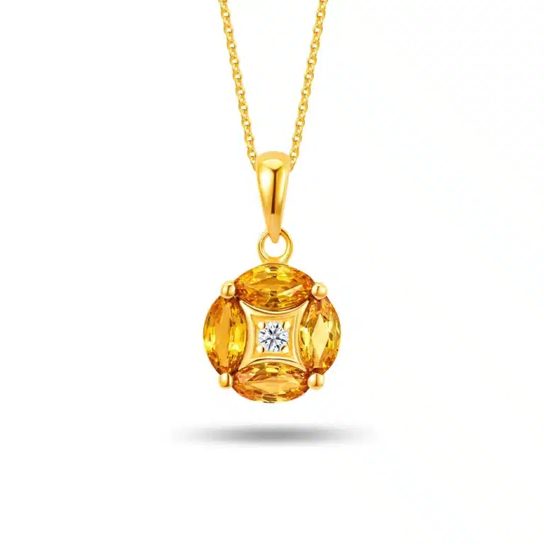 Dazzling Four Leaf 10k Gold Pendant Necklace for women featuring four oval-shaped yellow sapphires (0.69 carats) and a sparkling central diamond (0.02 carats) in a clover design with detachable 10k yellow gold chain.