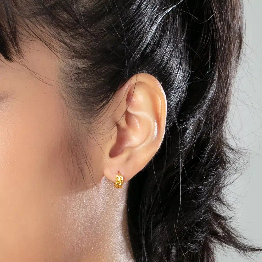 women wearing SK Classic Rustic Hoop Gold Earrings