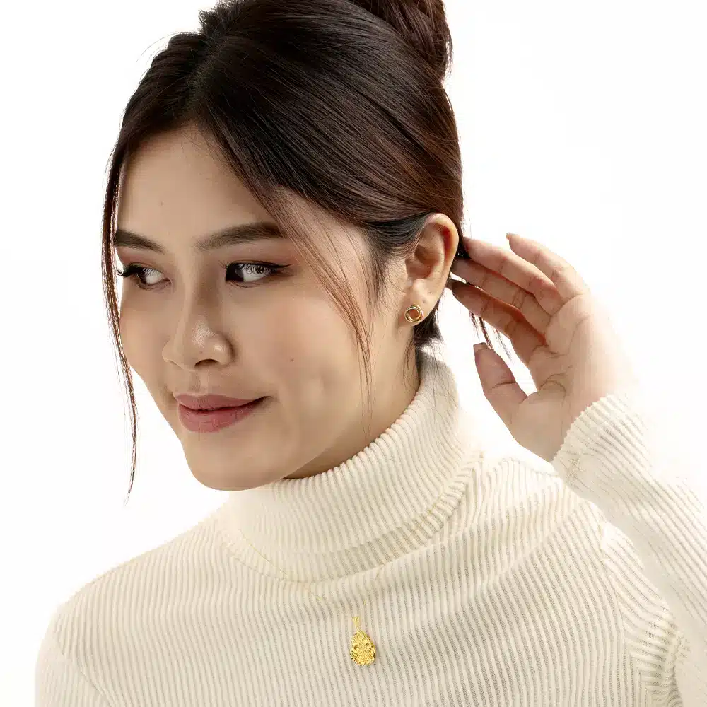women wearing SK 916 Dual Spiral Stud Earrings crafted from 916 yellow gold with a dual-tone spiral design in gold and white finish