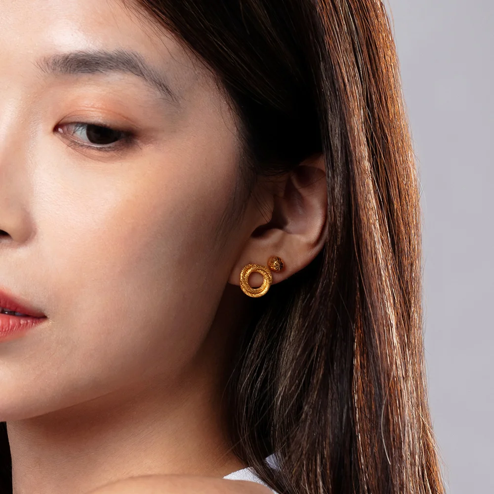 women wearing Radiant Gleam 916 Gold Stud Earrings and SK 916 gold dual spiral earring