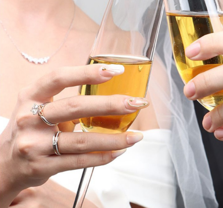 Bride wearing diamond wedding band and solitaire diamond engagement ring