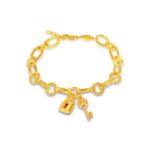 SK BRACELET FOR WOMEN SERENITY a chunky and stylish bracelet featuring a chain of oval and circle links with a set of dangling charms of a lock and a key made in 916 gold